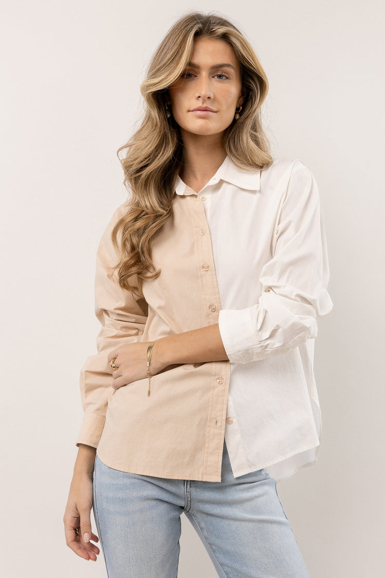 model wearing tan and white color block button down