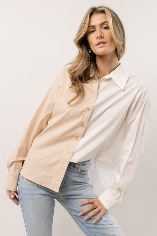 model wearing tan and white color block button down