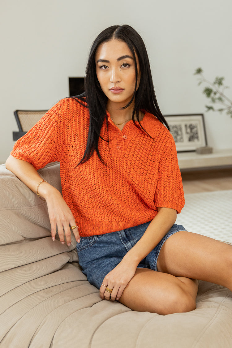 Med wash denim pared with the coral short sleeve sweater 