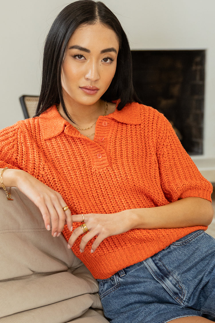 Gold jewelry pared with Coral short sleeve sweater