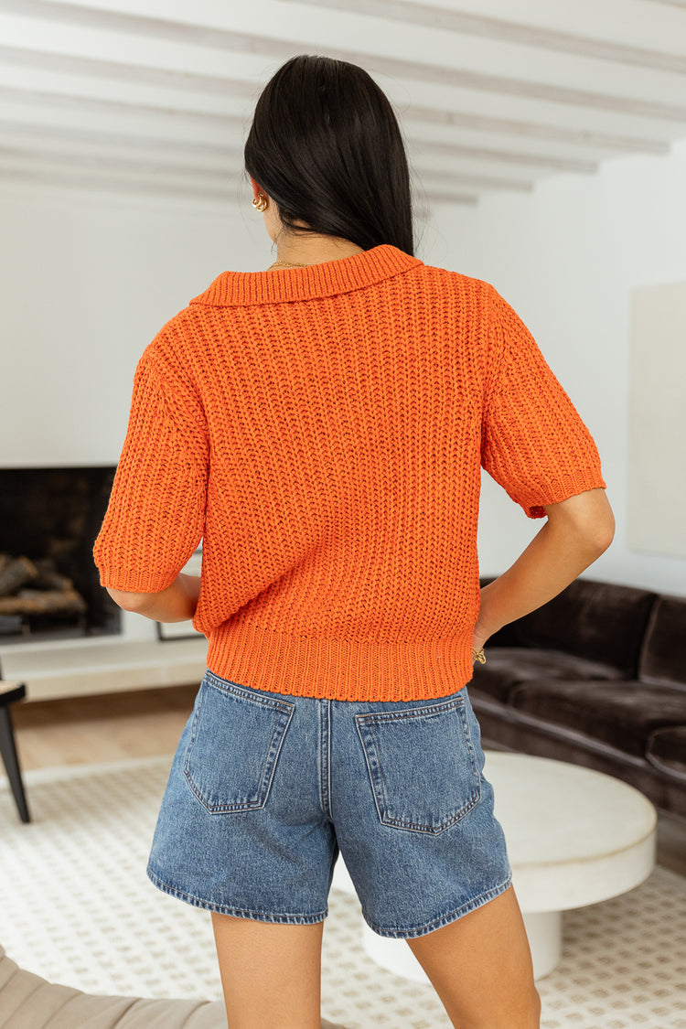 Backside of coral short sleeve sweater  