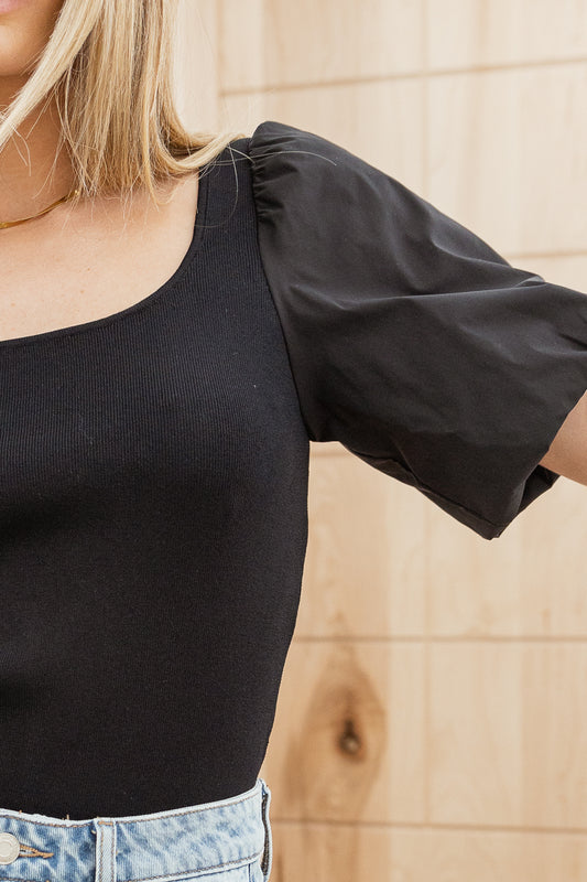 close up of black short sleeve top