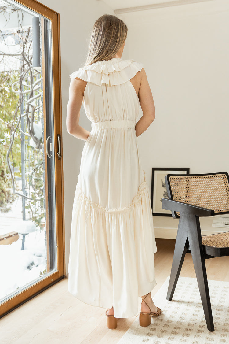 backside of cream dress with synched mid section