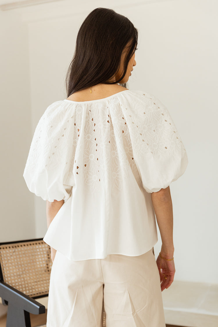 back view of white embroidered blouse