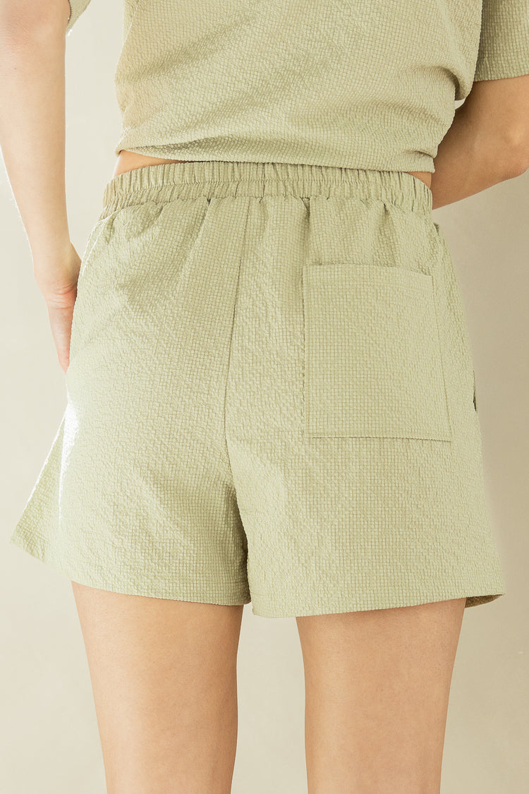 close up back of green shorts