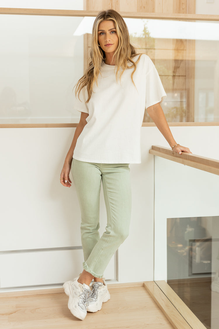 white t shirt with sage straight leg jeans