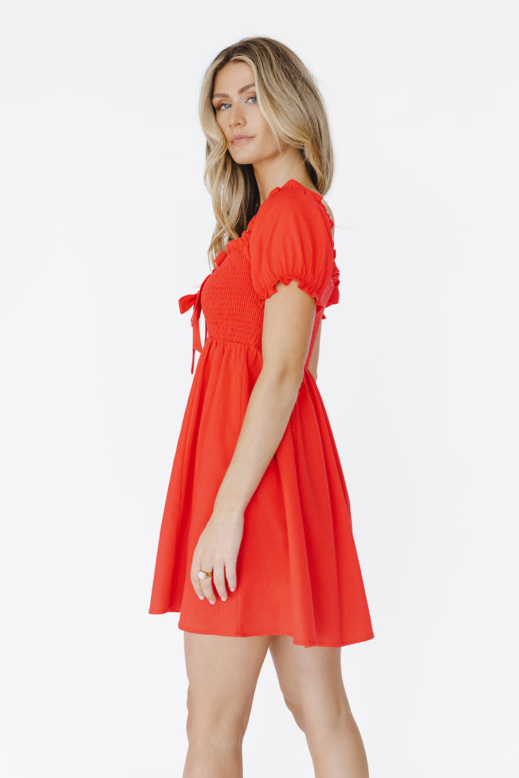 side view of red mini dress slight puff sleeve