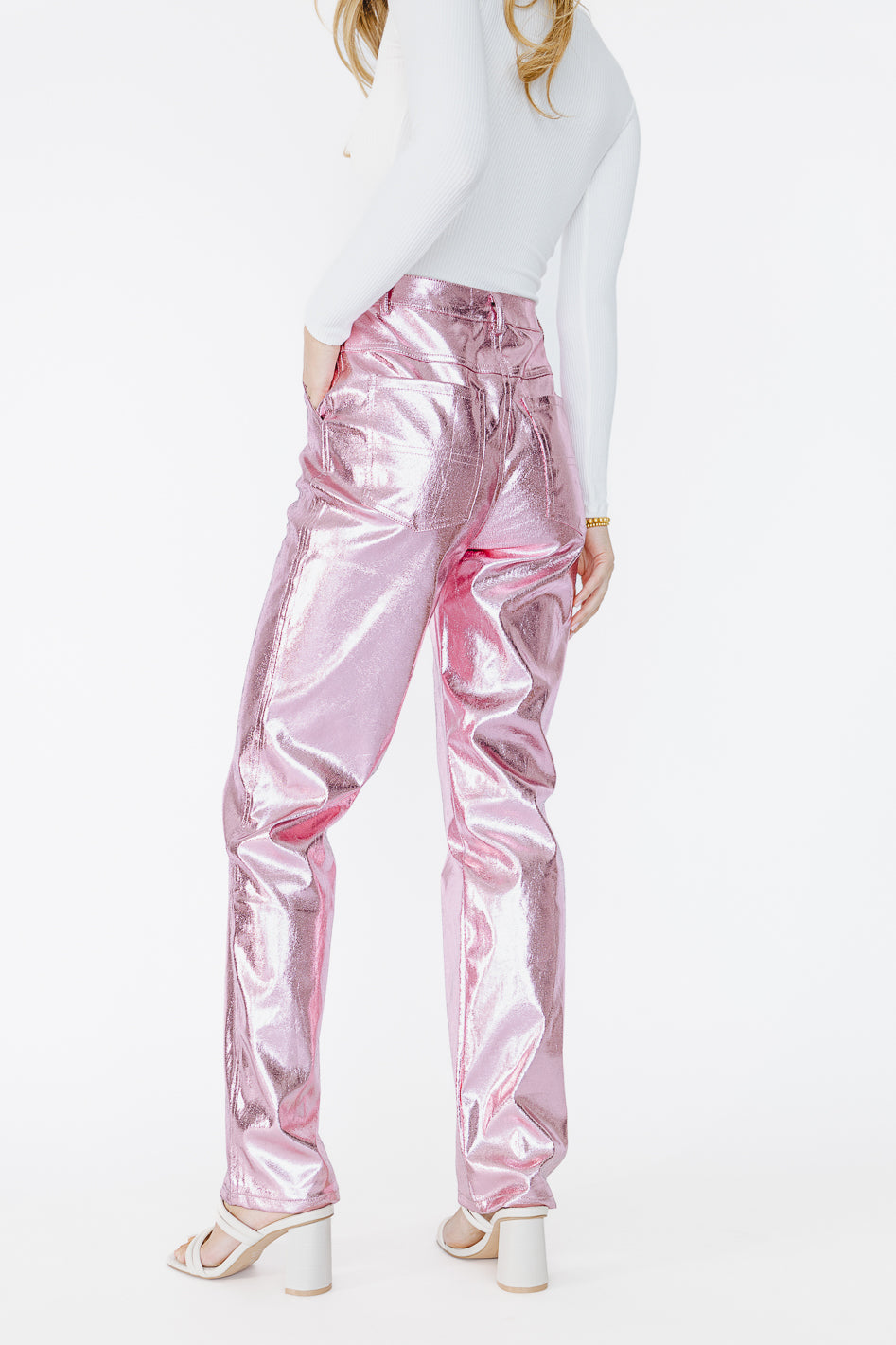 Khloé Kardashian wears hot pink metallic trousers on 'Hot Ones'