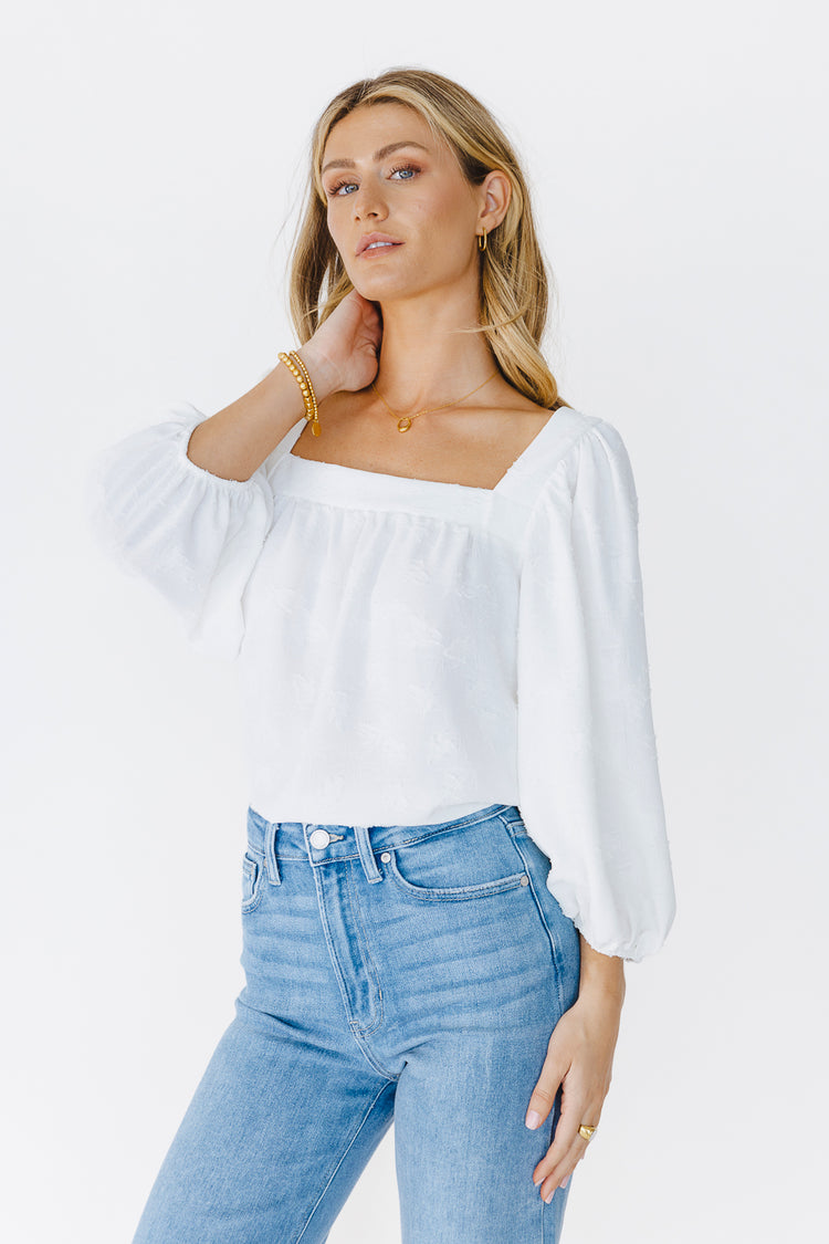 white long sleeve textured blouse with jeans