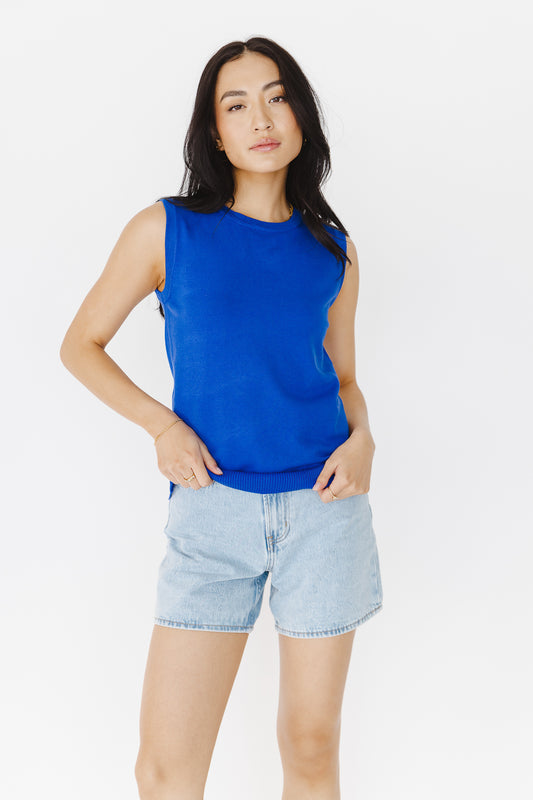 sleeve less royal blue sweater with light wash shorts