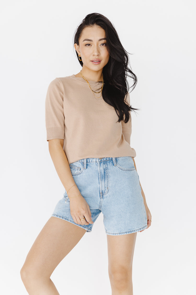 taupe short sleeve top with light wash shorts