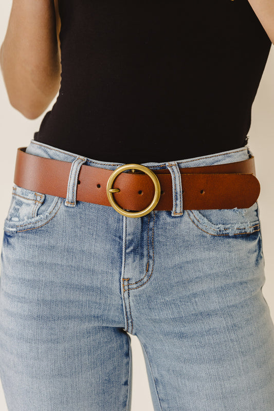 tan leather belt with gold circle hardware