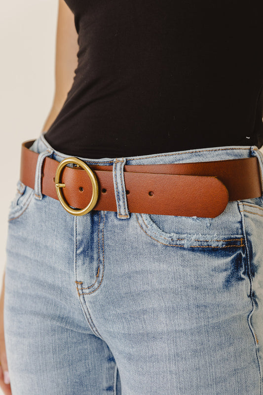 model wearing tan leather belt