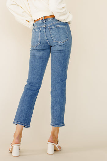 Two back pockets straight legs in medium wash 