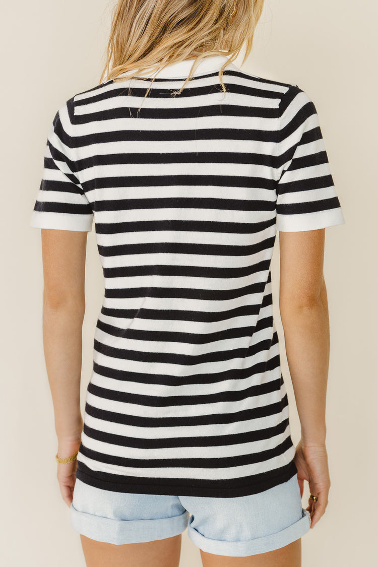 backside of stripped shirt with collared neckline 