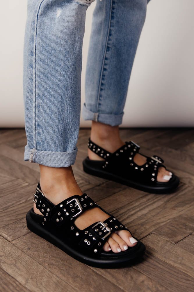 black sandals with studded details