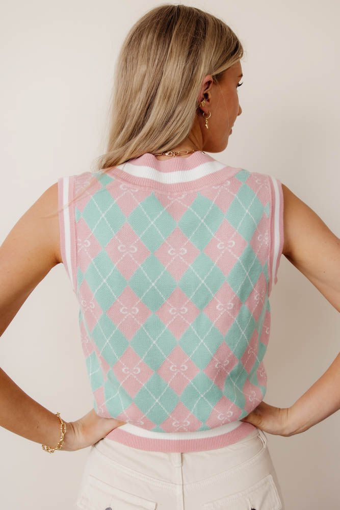 pink sweater vest with argyle print