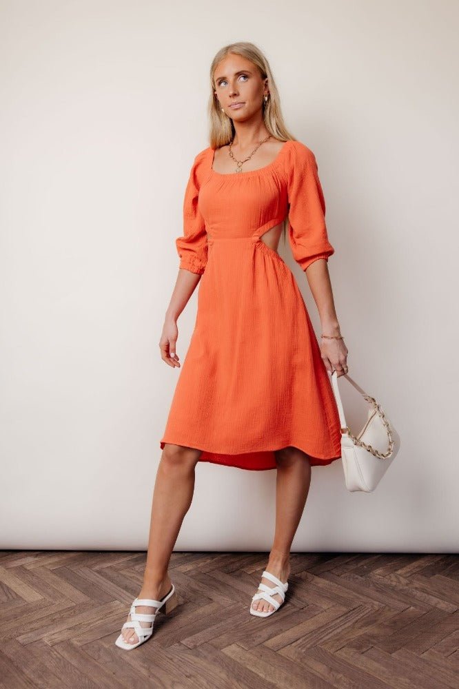 coral colored dress with side cutout