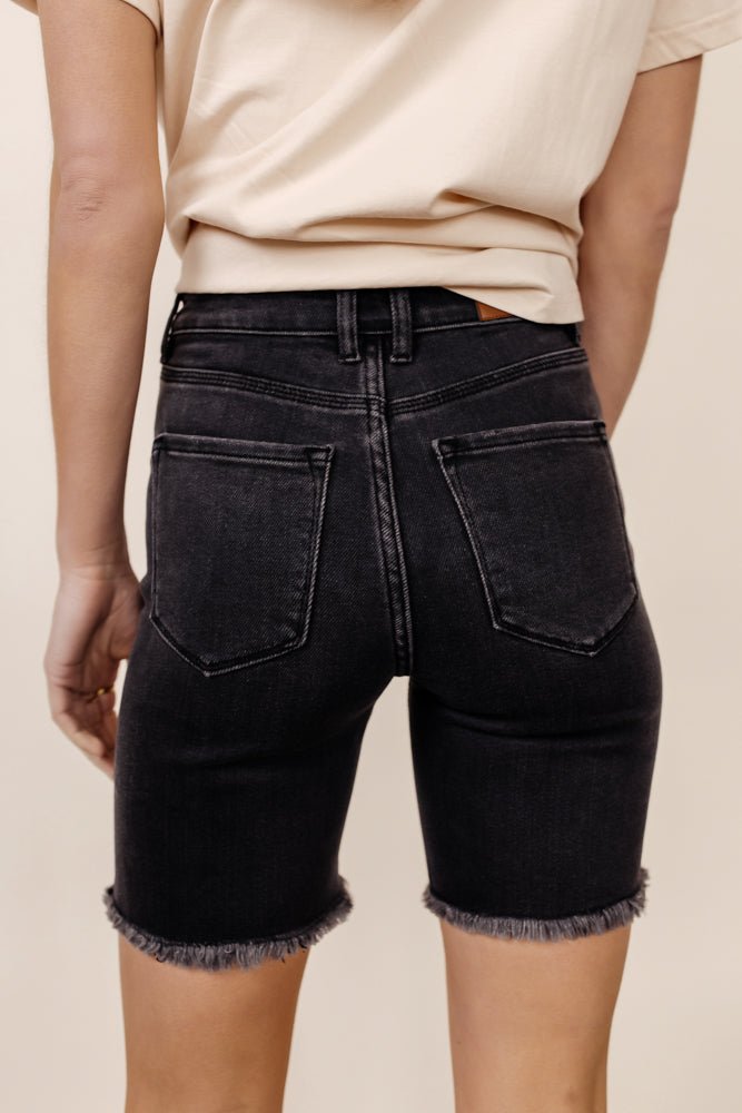 back view of black denim shorts