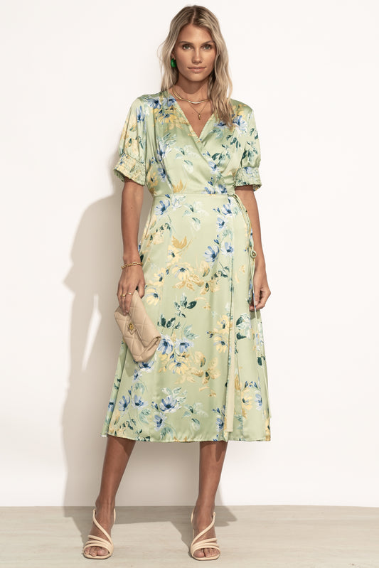 green floral wrap-style dress