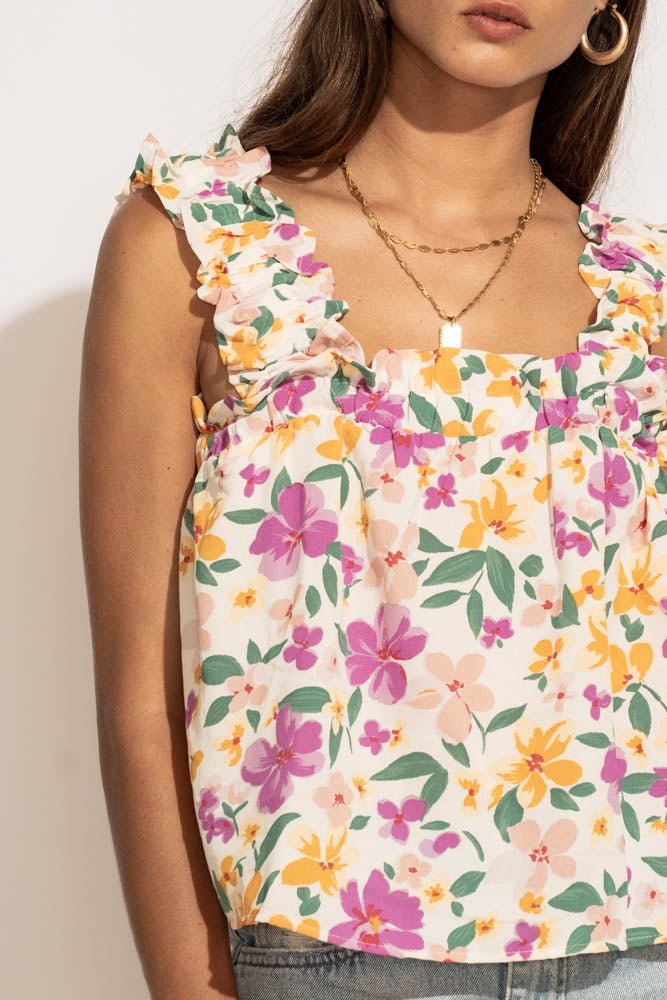 A model wearing the Arielle flowy floral tank top.