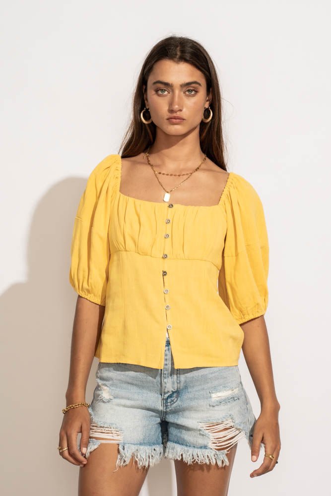 yellow blouse with buttons
