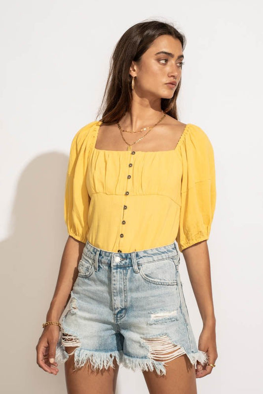 yellow blouse with puff sleeves