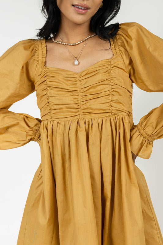 mustard dress with ruched detail
