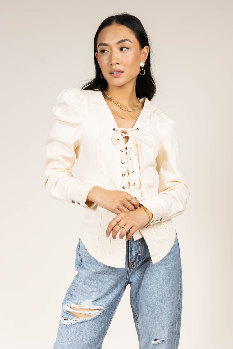 cream long sleeve top with tie detail