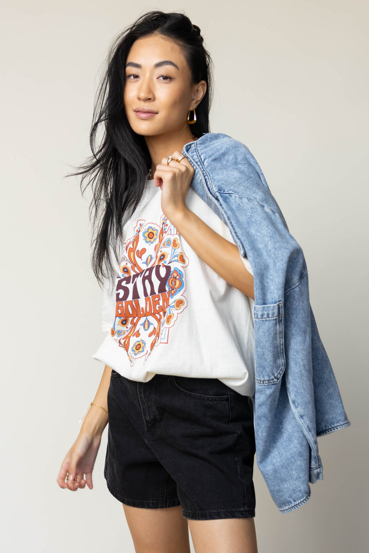 stay golden tee with denim jacket and black shorts