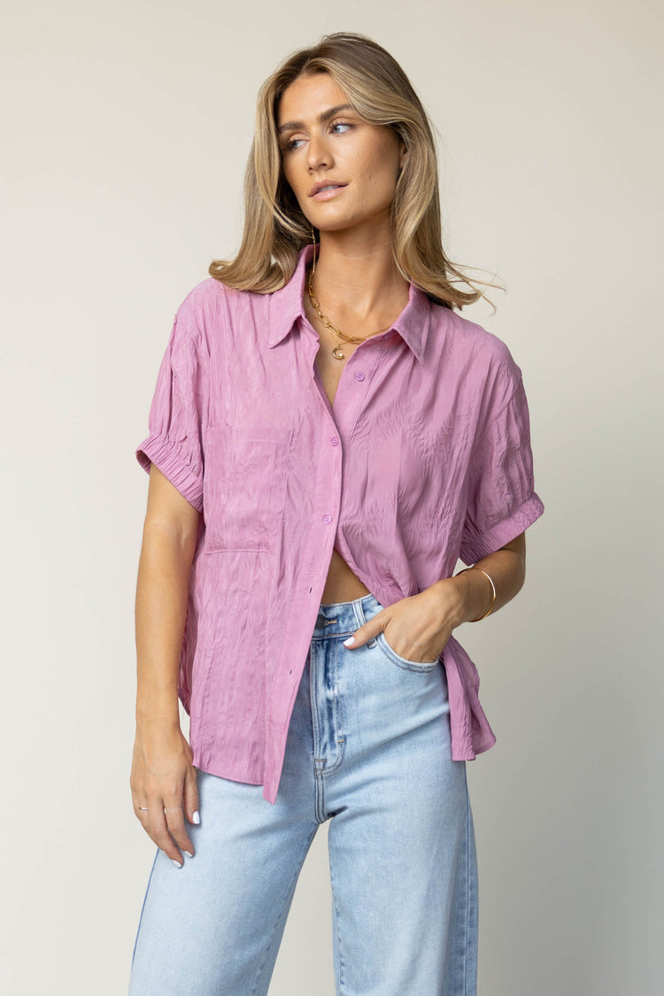 pink blouse with half moon necklace