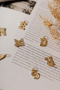 Alphabet charms in gold 