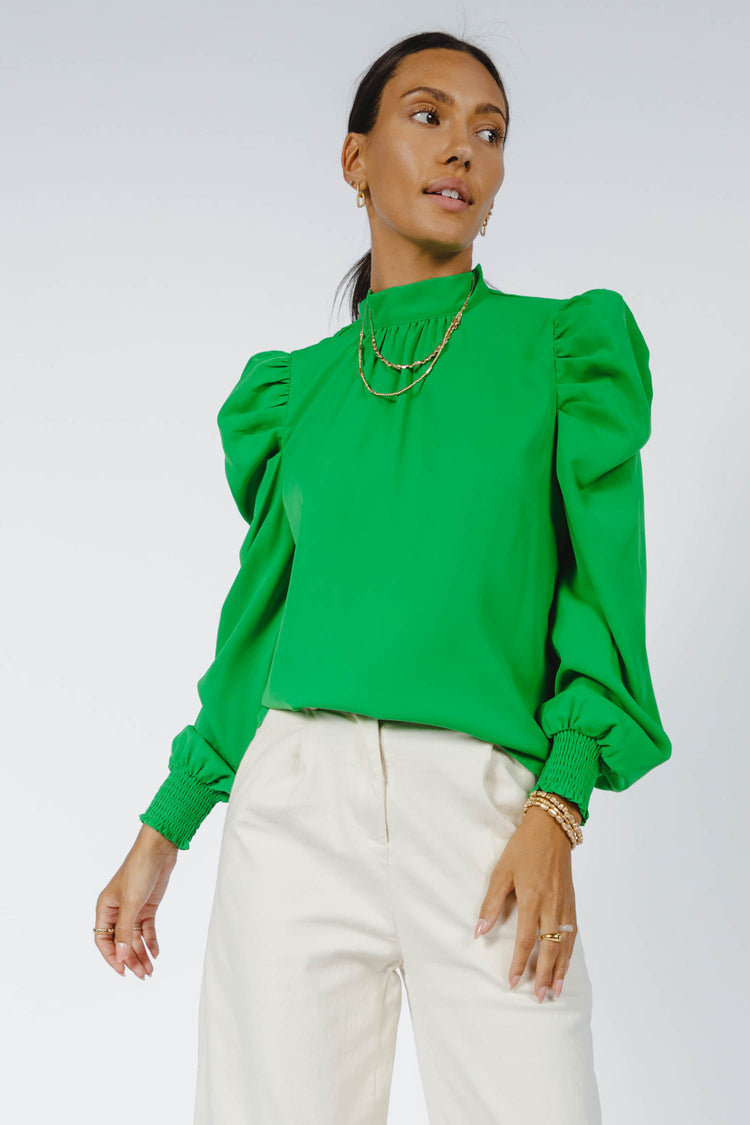 green blouse with puff sleeve