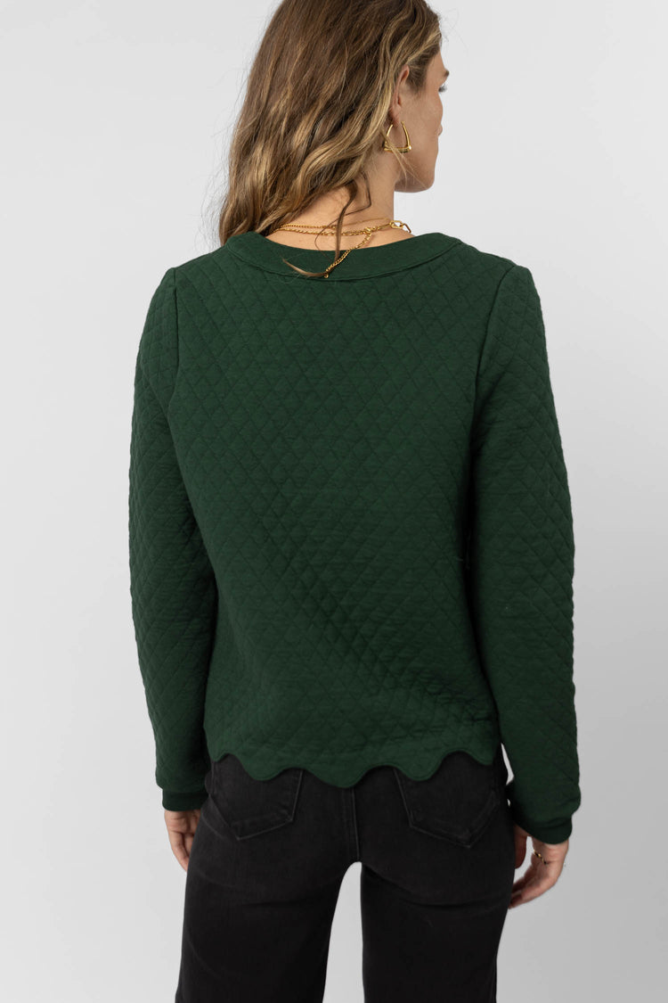green cardigan with scalloped edges