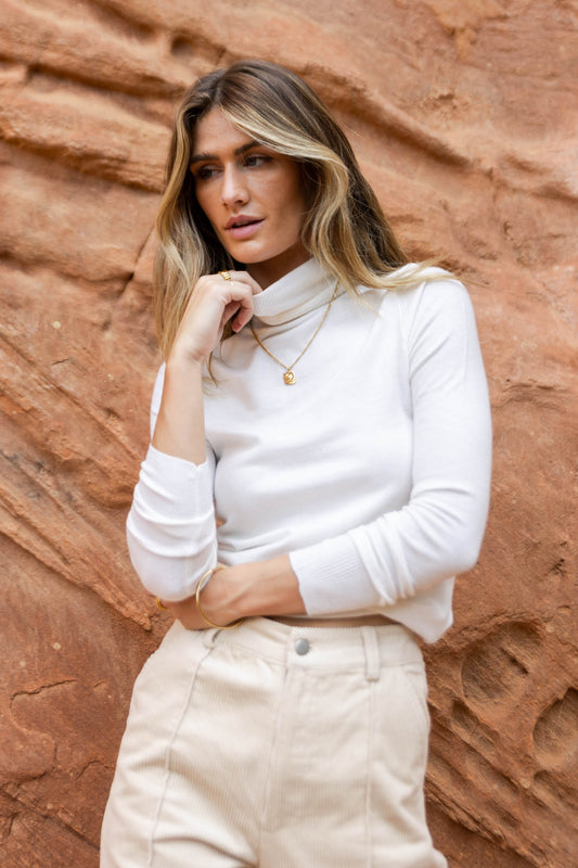 fitted white turtleneck top
