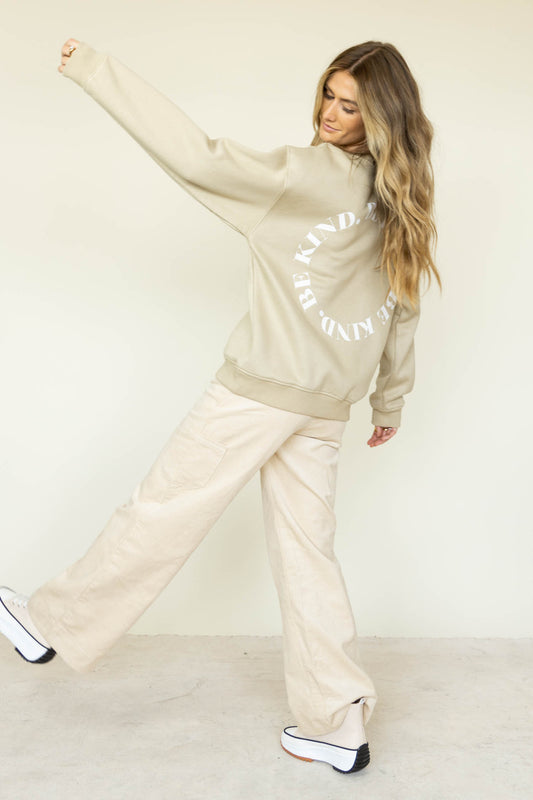 taupe graphic pullover with corduroy pants