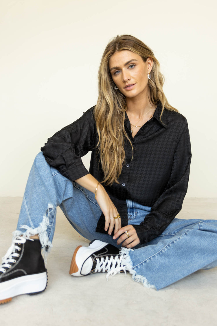 black button down with denim and black sneakers