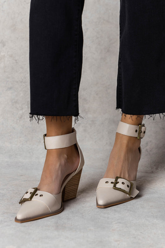 white heels with buckle detail