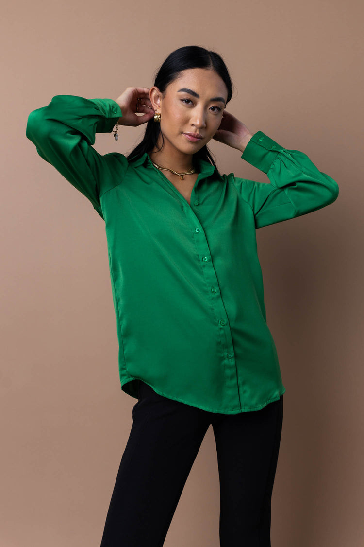model wearing green button up
