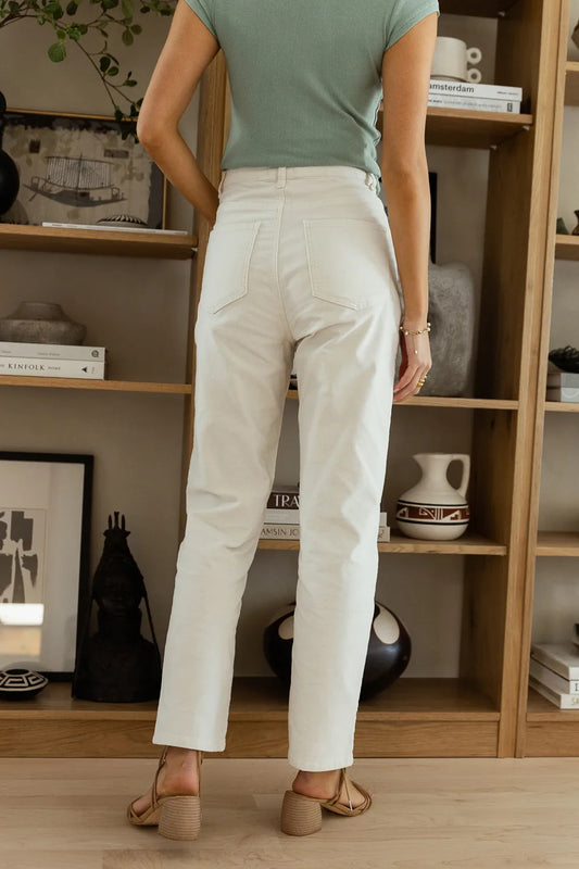 off white pants paired with tan heels