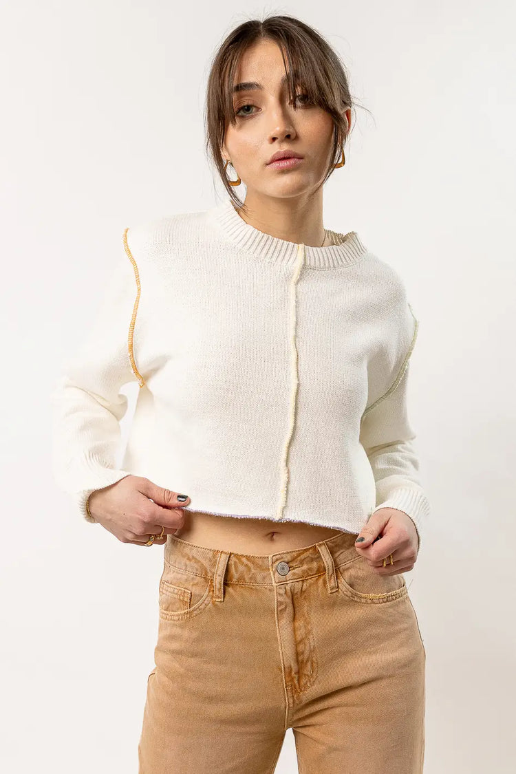 ivory sweater with stitching detail