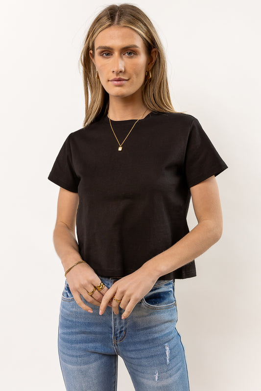 black short sleeve baby tee paired with denim