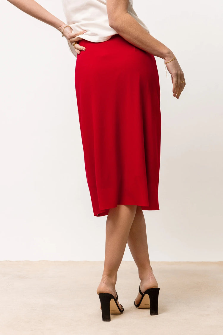 red mesh midi skirt paired with black heels