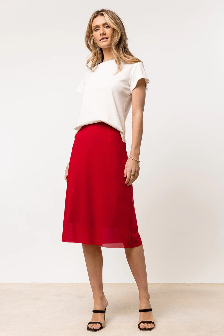 red midi skirt paired with white tee