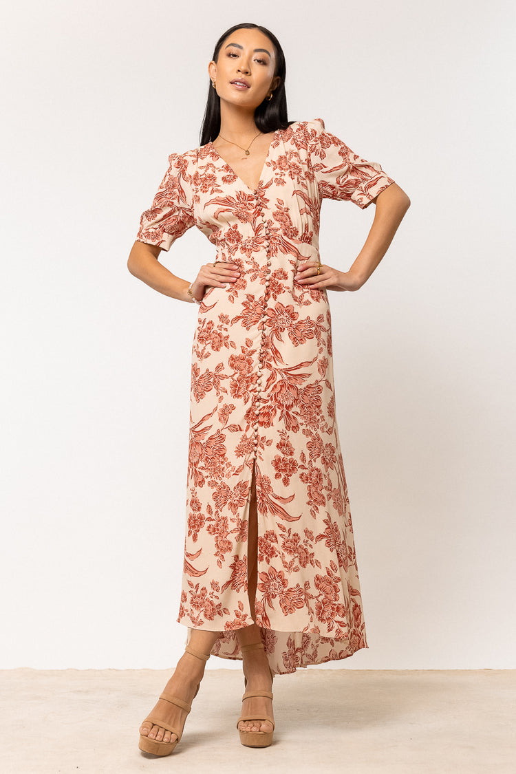 rust floral midi dress paired with nude heels