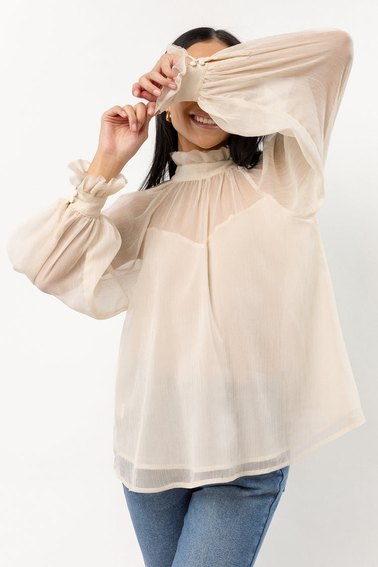 long sleeve cream blouse