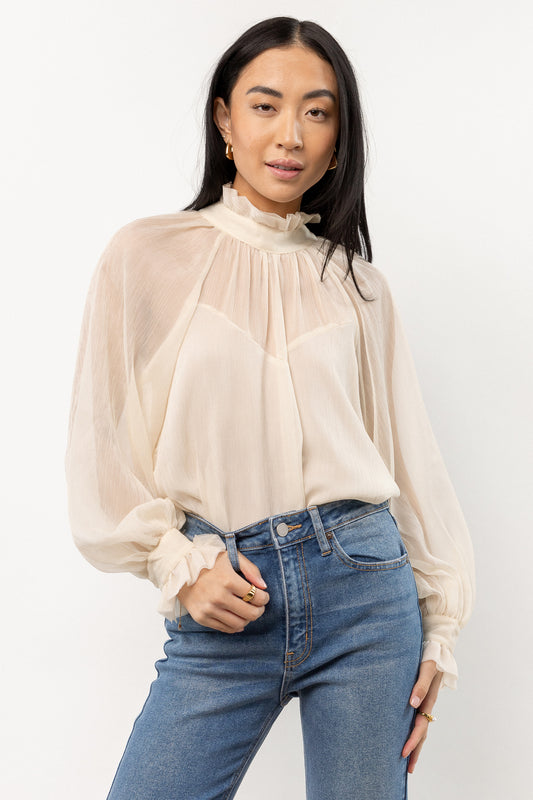 cream blouse with sheer sleeves