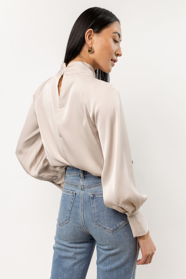 cream blouse with high neck