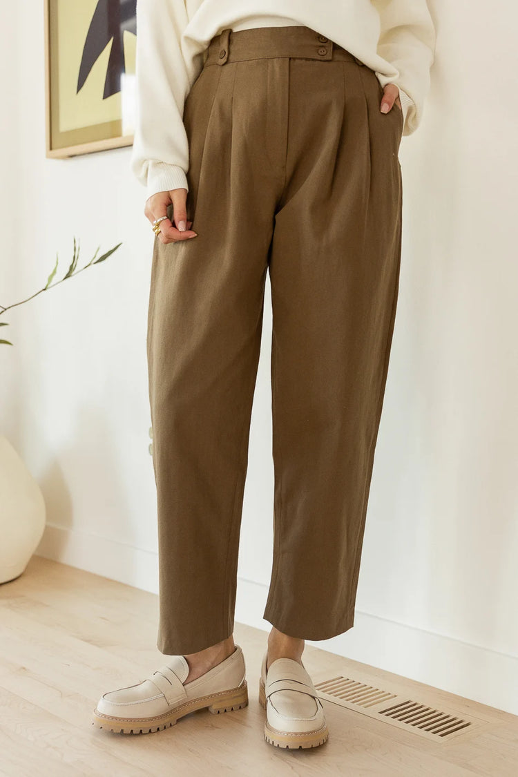 khaki trousers with pleat details