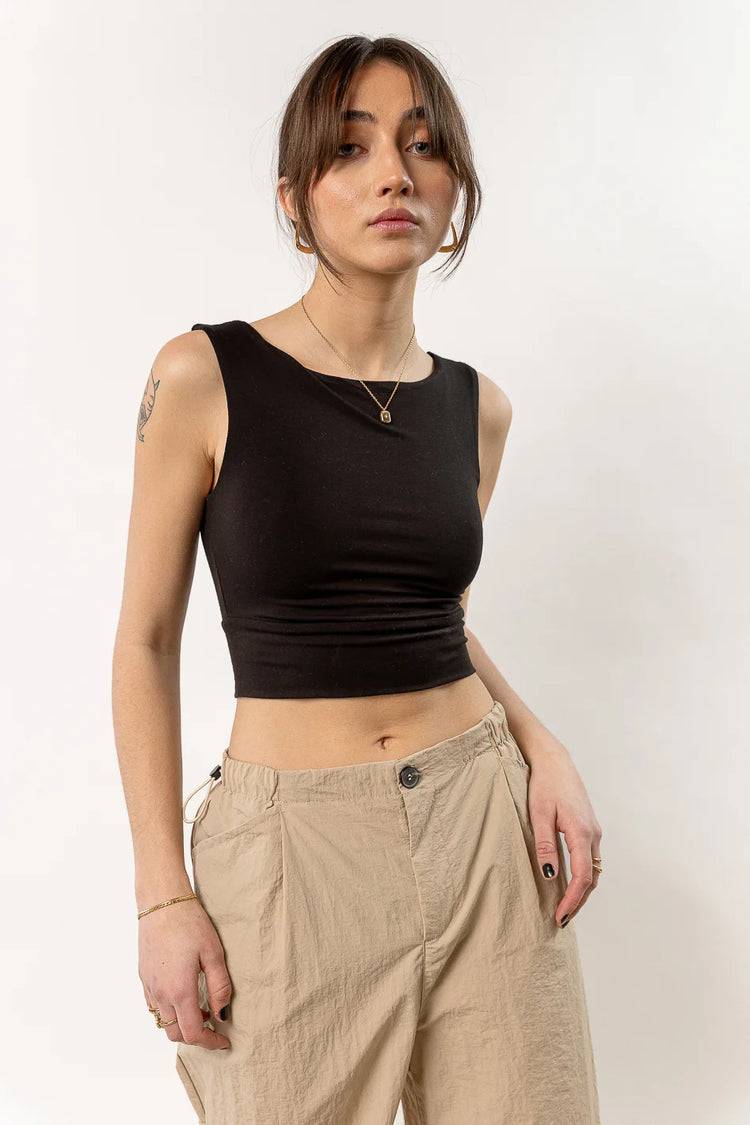 black tank top paired with camel pants